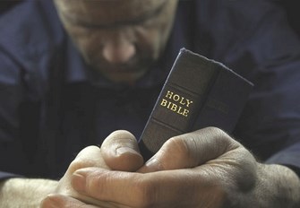 man-praying-with-bible Copy